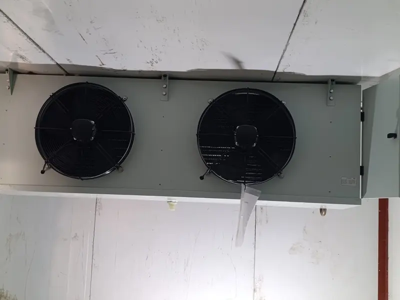 Dual-fan evaporator unit mounted on a coldroom ceiling
