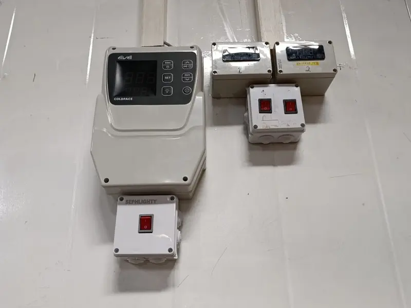 Eliwell Coldface coldroom controllers and switches on an insulated panel wall