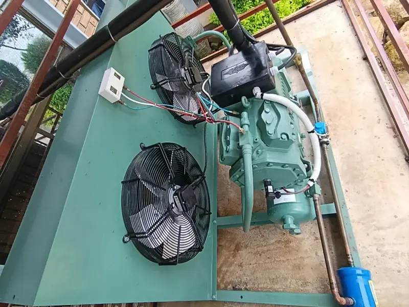 Semi-hermetic refrigeration condensing unit with dual fans and compressor